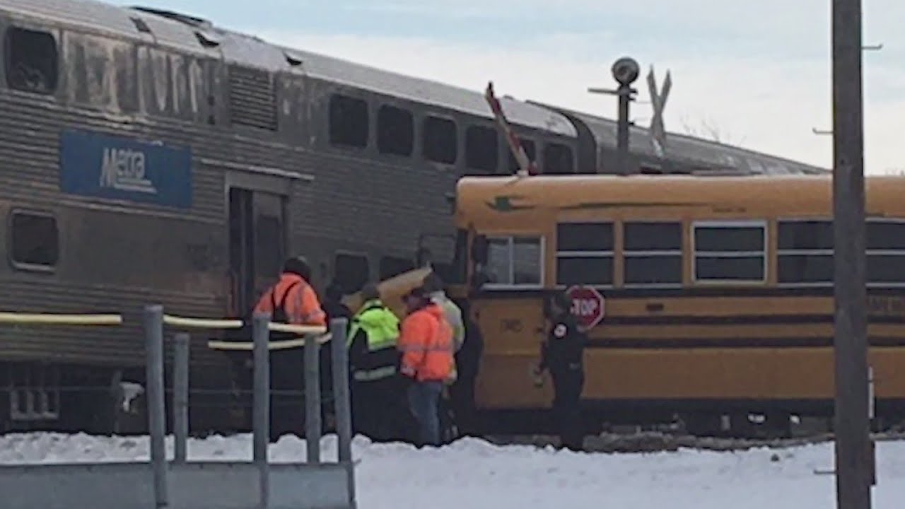 School bus driver evacuates students ahead of collision with train in ...