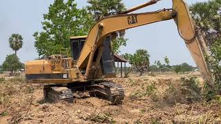 Yellow Caterpillar is digging the tree log bank canal #excavator #caterpillar