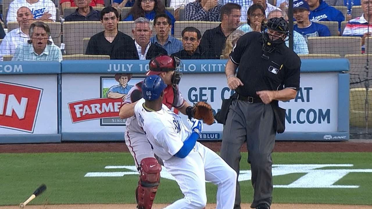 Yasiel Puig flips his bat after a fly ball that doesn't even make the