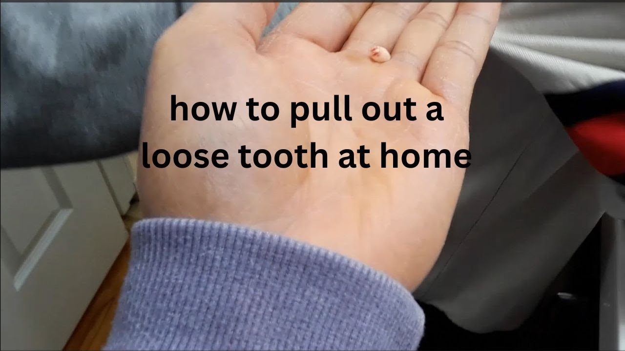 how to pull out a loose tooth at home - YouTube