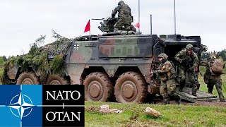 NATO Alliance. Tanks and combat vehicles during military exercises in Poland.