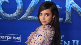 Sofia Carson wears a very long peacock style dress
