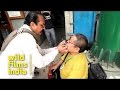 Indian dentist plies his trade - on the sidewalk!