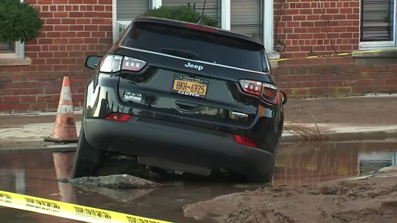 Water main break creates sinkhole that swallowed car - YouTube