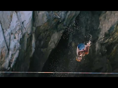 Crew Sets Up Slackline Over Sea Rigging It Between Cliffs