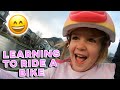 LEARNING TO RIDE A BIKE | 4 YEAR OLD LEARNS TO RIDE A BIKE FOR THE FIRST TIME | PRICELESS REACTION