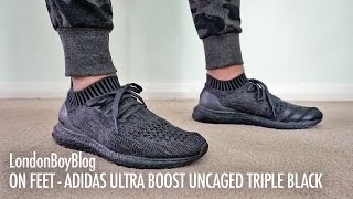 ultra boost uncaged black on feet