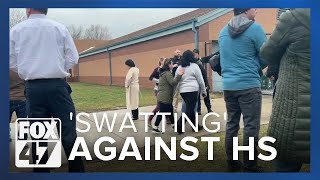 Parents reunite with students after fake threat put a high school into lockdown