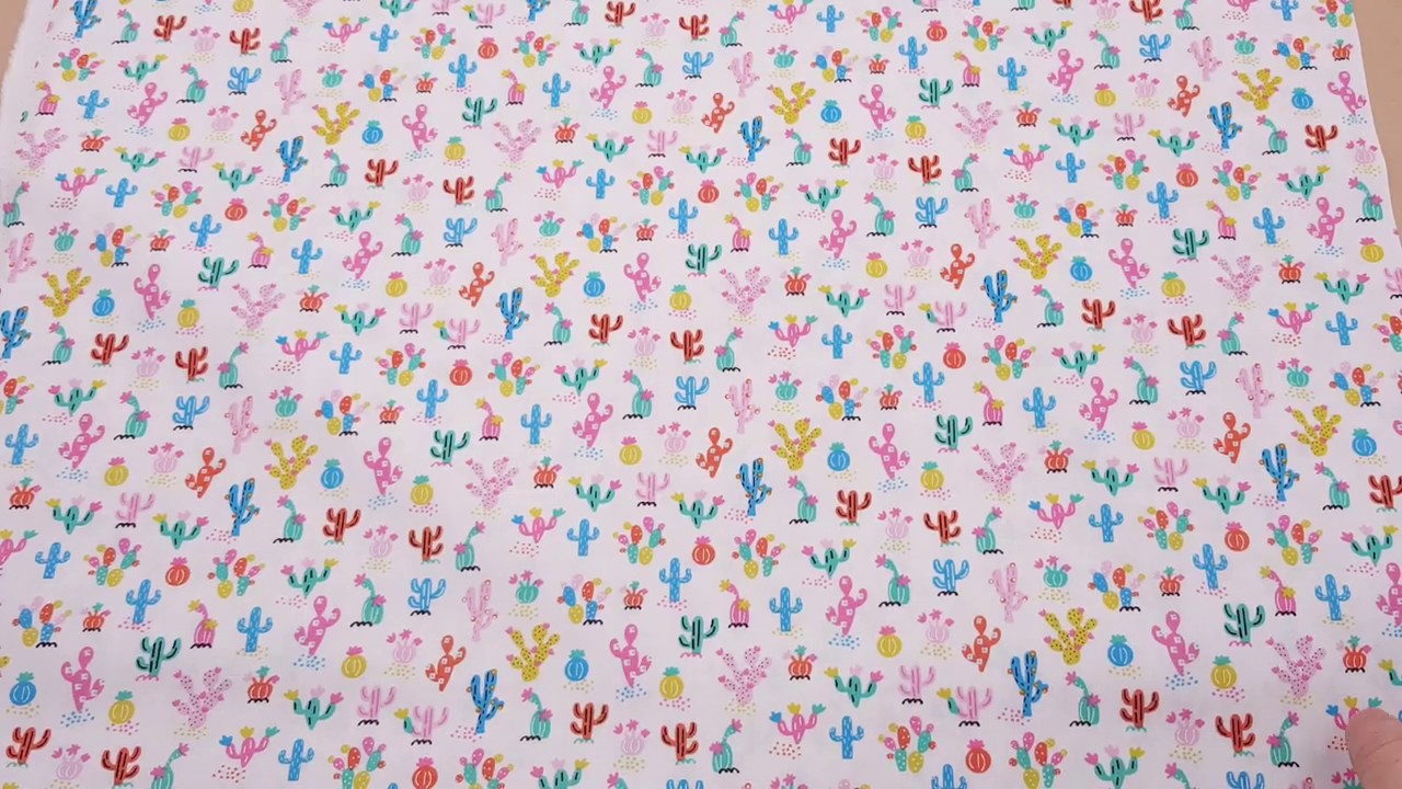 Timeless Treasures white fabric with colorful mini cactus plants
