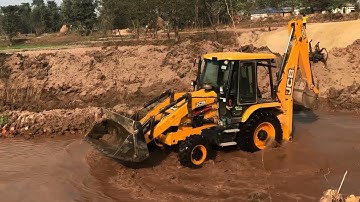 Backhoe Blocking Water in Small River& Working For Bridge Construction