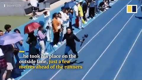 Speedy student cameraman keeps pace with sprinters in college dash in China