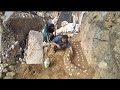 "Building a sheep feeding area with rocks and dirt and children returning home from school"**