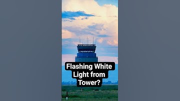 What does a flashing white light from tower mean?