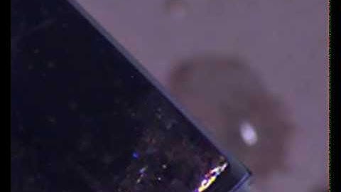 Two drop impacts on a superhydrophobic surface