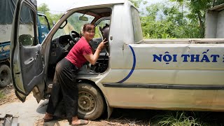 The girl repaired and restored a broken car in the middle of the street for her neighbor.