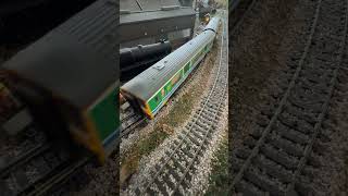 Class 150 Sprinter ambles up the back straight.