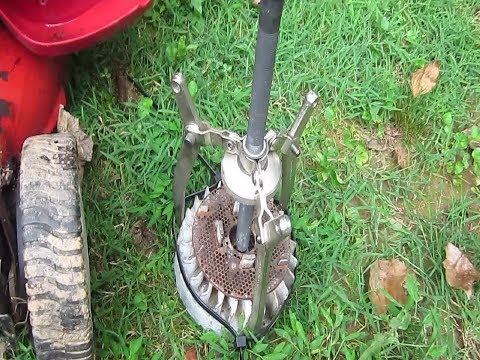 Vídeo: Como você remove o volante de um cortador de grama?