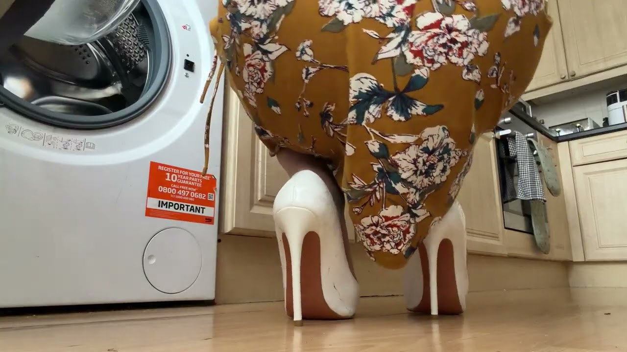 Cleaning kitchen appliances in sheer stockings and clicking patent leather heels