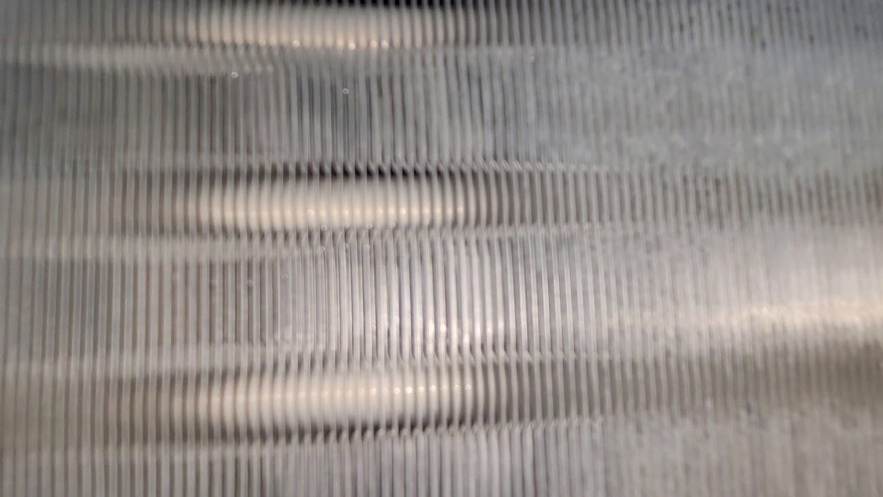 How much water continue to be trapped within a aircon fan coil after