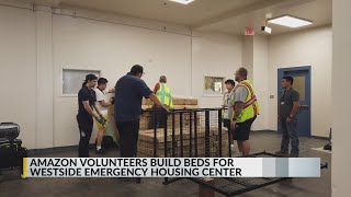 Amazon volunteers build beds for Westside Emergency Housing Center
