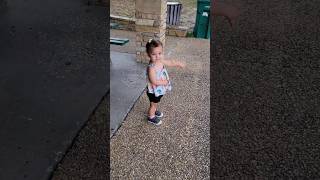 Baby waiting for rain to pass so she can go to playground