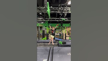 Young Ninja Conquers the Obstacle Course with Enthusiasm