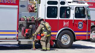 FIRE TRUCKS FIRE BOAT ASSIST IN FIRE ON BOARD THE DEFENDER