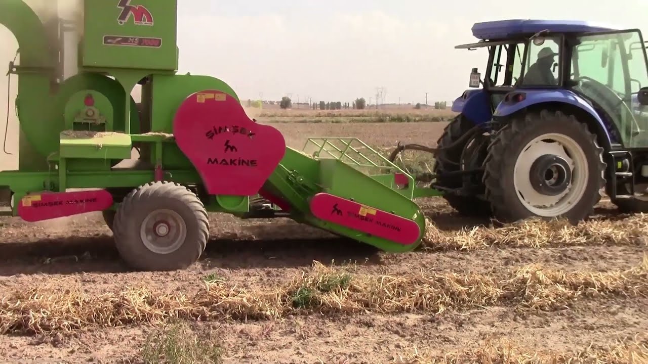 MAQUINARIA AGRÍCOLA COSECHANDO DE FRIJOL