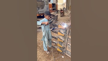 A small boy welding a excavator new bucket teeth #shortvideo #welding #excavator