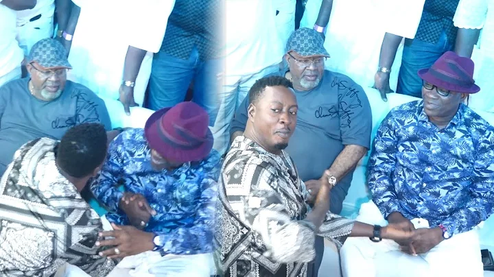 K1 DE ULTIMATE SHOWER PRAYER ON TAYE CURRENCY AS HE KNEE DOWN  TO GREET HIM AT MALAIKA`S BIRTHDAY