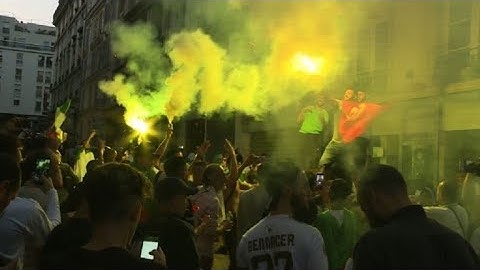 Algerian supporters celebrate in Paris during the AFCON final | AFP