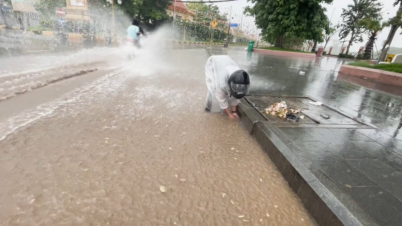 Unclogging Drain Culvert Water After Heavy Rain On Street Road - YouTube