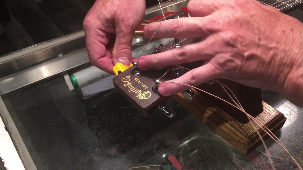 How to instal strings on an acoustic using a luthier's knot Martin