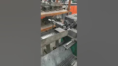 Production of spring in wire mesh container