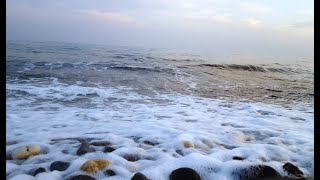 Sea Pebbles in the beach, stone sound, gravel stones with water, waves crashing on rocks