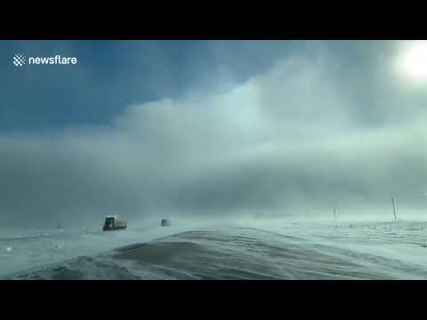 Incredible footage shows rare sun dog phenomenon during polar vortex on US highway