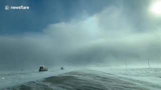 Incredible footage shows rare sun dog phenomenon during polar vortex on US highway