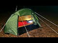 Wild camping tent camping in wild woodland  bushcraft cooking a cowboy steak over hot campfire