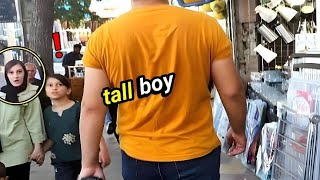 Peoples Reaction To The Tall Boy In The Street Walking Among People With A Height Of 7 Feet Resimi