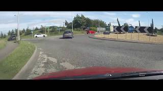 German Truck Pulls Out on Traffic on Roundabout