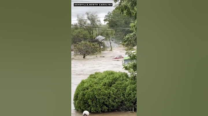 House floats through flooded streets in Asheville, North Carolina after Hurricane Helene