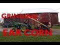 helping the neighbor grind ear corn!