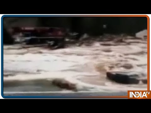 Road Crumbles against Rushing Flood Water in Spain