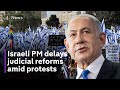 Netanyahu delays judicial reforms as mass protests continue in Israel