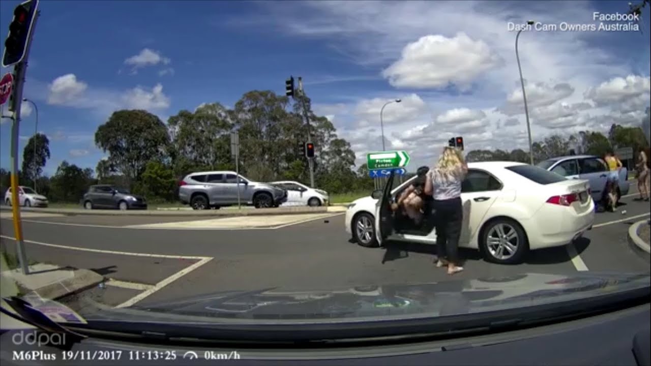 Bizarre moment a woman jumps out of car crash with her pants down - YouTube