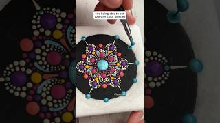 Painting a summertime mandala on a piece of Santorini Marble. It turned out really pretty ?