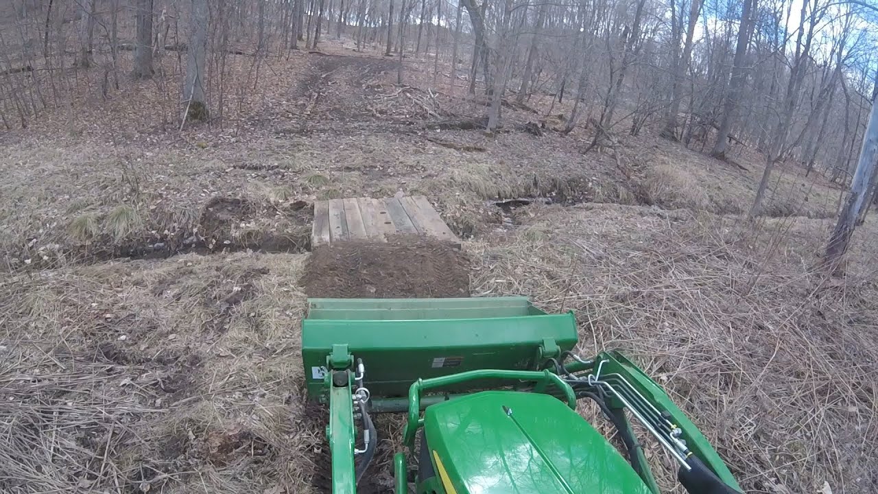 Building a bridge over a creek for 1025r out of old railroad ties part 2