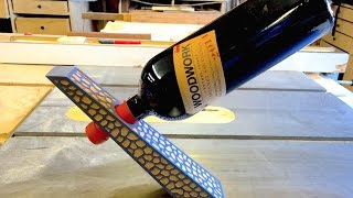 Here is a wine bottle holder that I carved in my signature leopard print design. Its made in Mahogany and black veneer. It is 