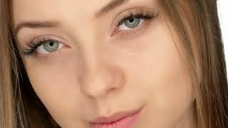 Portrait Of The Girls Eyes Close Up Macro On The White Background In Slow Motion