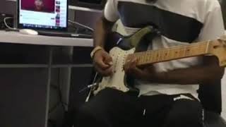 Fiokee playing guitar on Oh my gosh by Yemi Alade ft Rock Ross